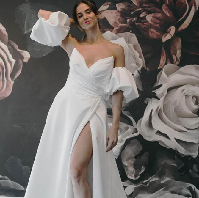 Model wearing a white gown by Mikaella